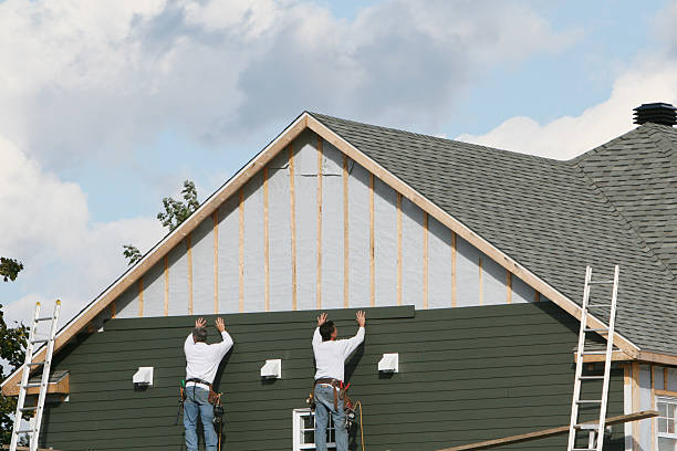 Professional Siding Installation technician working in Delta, OH
